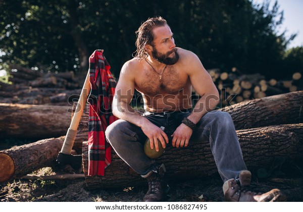 lumberjack-axe-water-forest-600w-1086827495.jpg