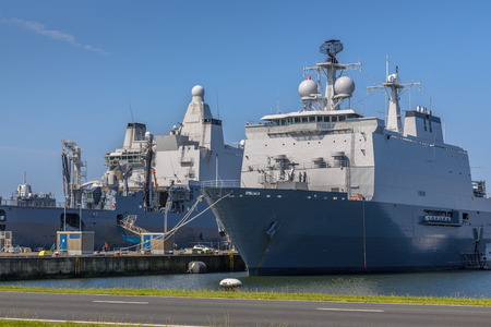 51107332-dutch-navy-ships-in-a-harbor-loading-for-their-next-mission-at-den-helder-naval-base.jpg
